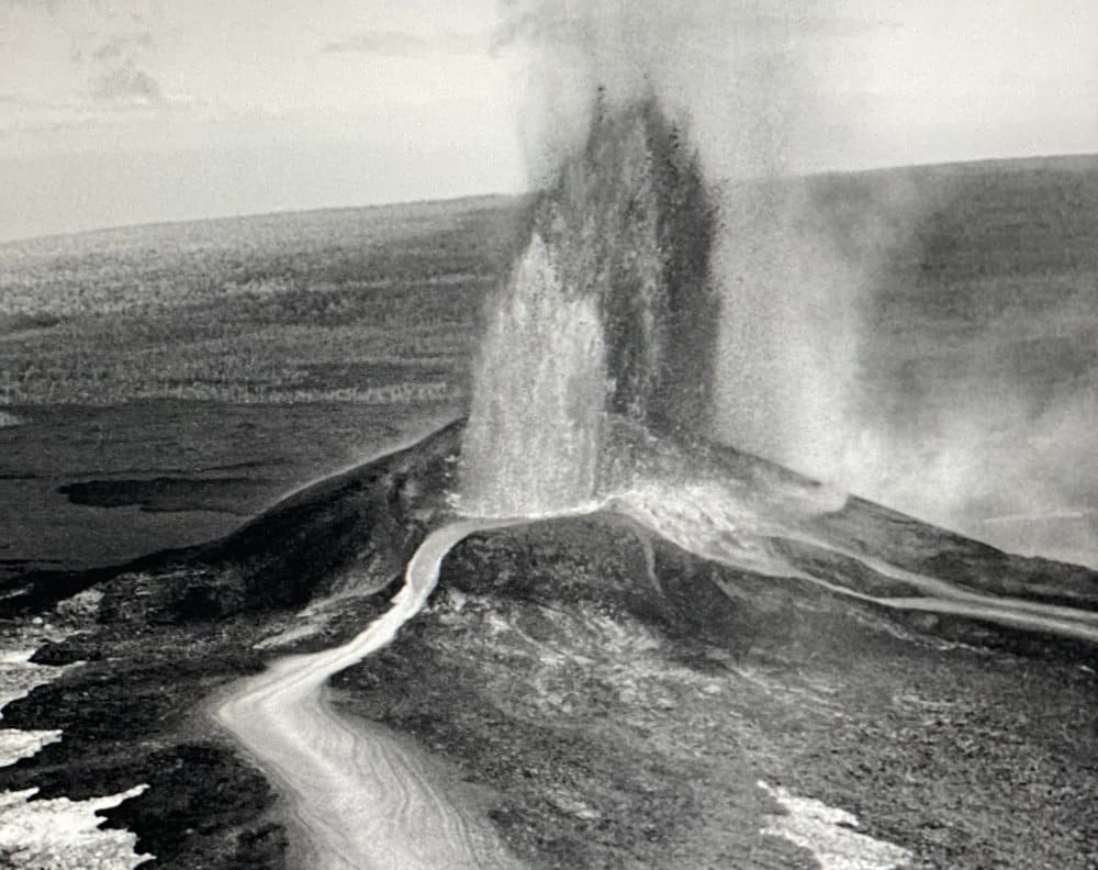 Archive photo of woman golfing into Kilauea crater.