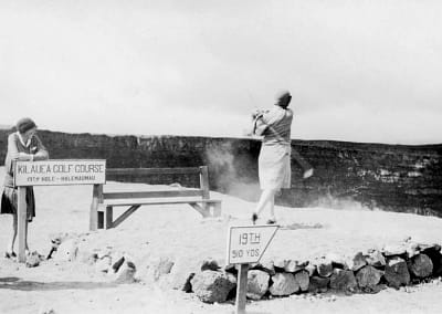 Archive photo of woman golfing into Kilauea crater.
