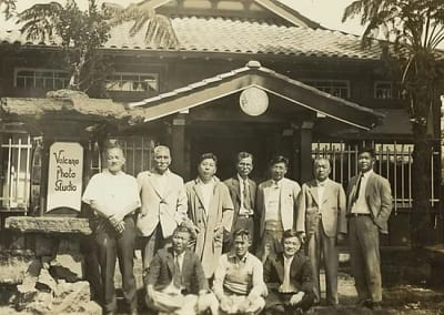 Kenichi Maehara and his colleagues pose outside the Volcano Photo Studio.